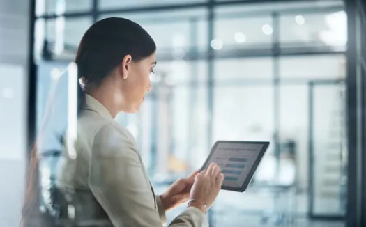 Businesswoman looking at tablet